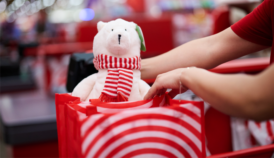 Target shopper choosing exclusive holiday gifts