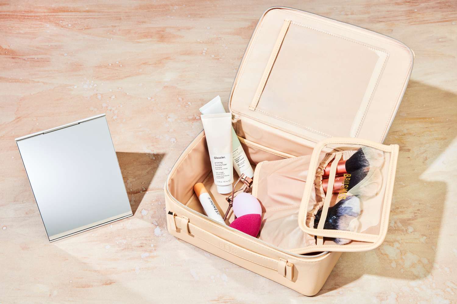 Beauty products arranged beside price intelligence insights on a tablet